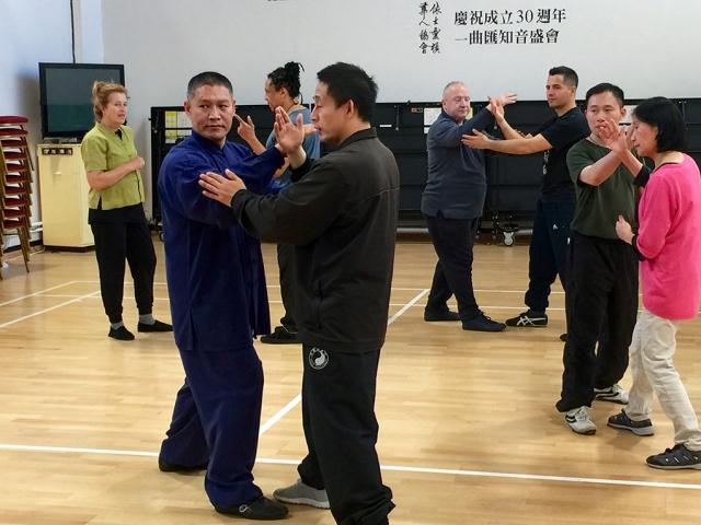 Chen Ziqiang with Shifu Liu demonstrates push hands practice at a TJC London workshop