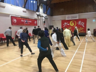 Shifu Liu adjust posture in the Chen taiji class Shifu Liu check student posture in the Fundraiser taiji class