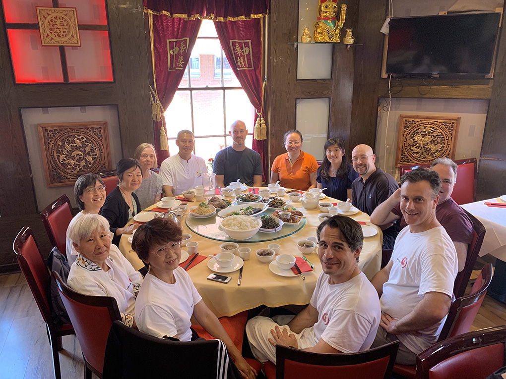 TJC students and friends relax with a meal in China Town